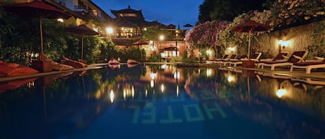 2 outdoor pools, open 7:00 AM to 10:00 PM, pool umbrellas, pool loungers