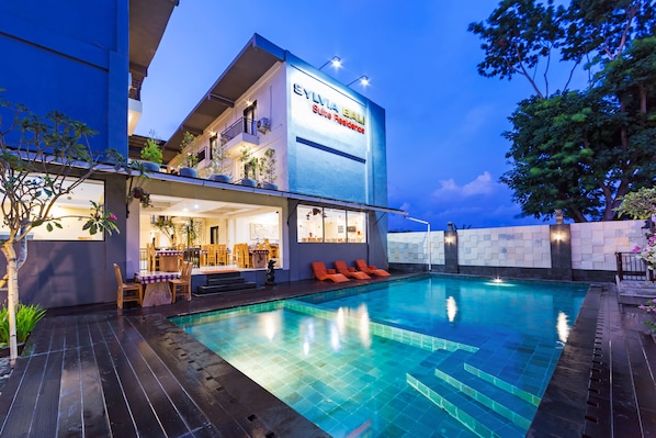 Outdoor pool, open 7:00 AM to 11:00 PM, pool umbrellas, pool loungers