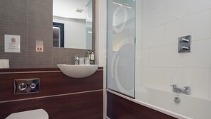 A modern bathroom with a toilet, sink, and shower. - Fletcher's Restaurant Bar & Rooms (Stirling)