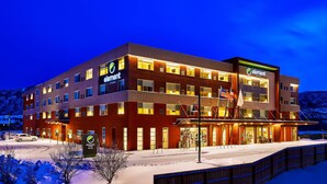 A multi-story hotel with a modern design, featuring a prominent 'element' sign, a covered entrance, and a snow-covered ground. - Element by Marriott Basalt - Aspen (Basalt)