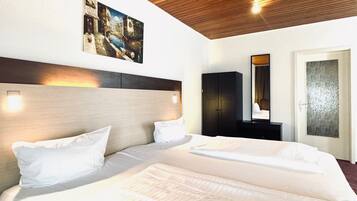 Superior Apartment | Hypo-allergenic bedding, down comforters, in-room safe, desk