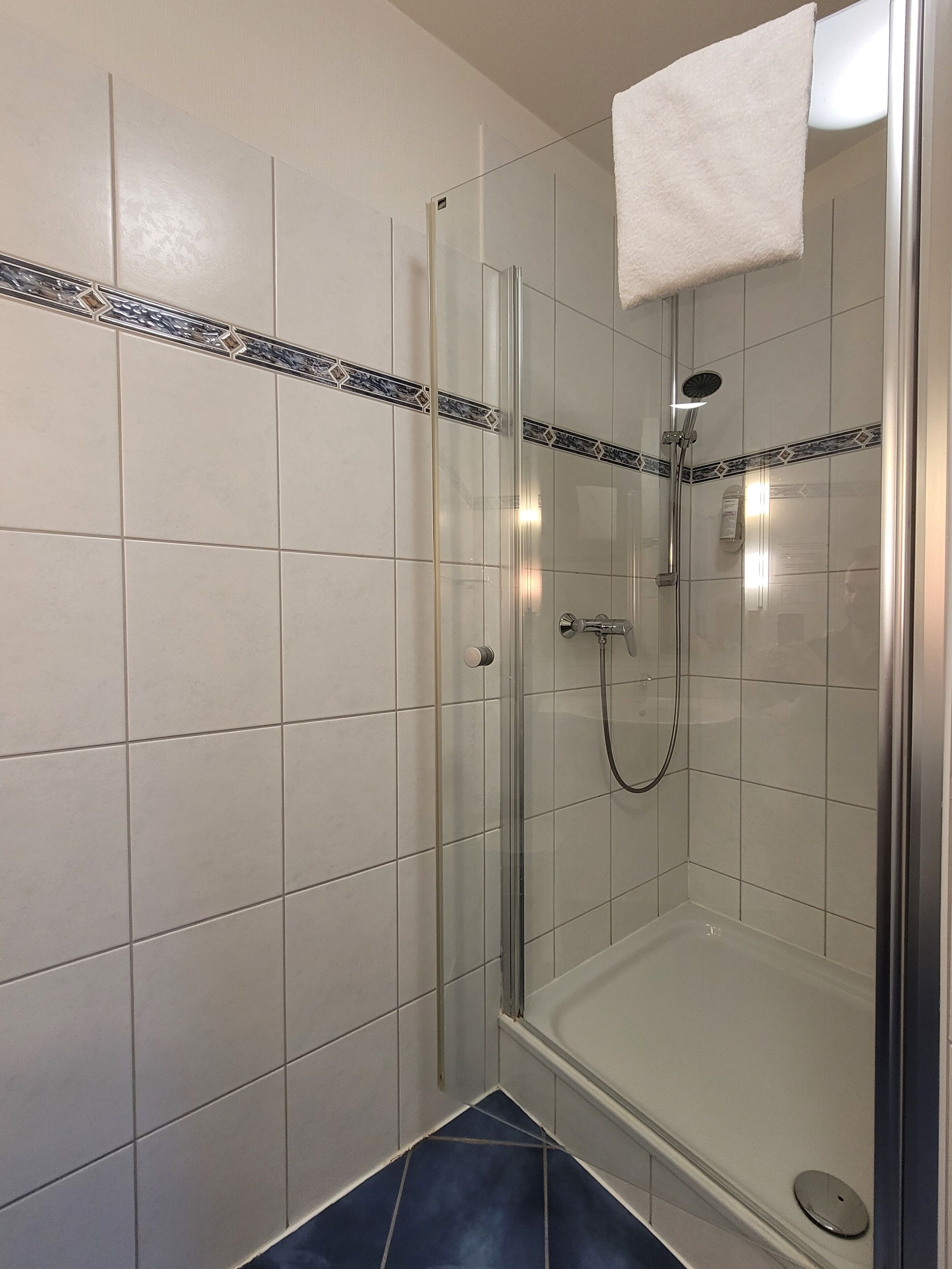 quadruple room | bathroom | shower, hair dryer, towels, soap