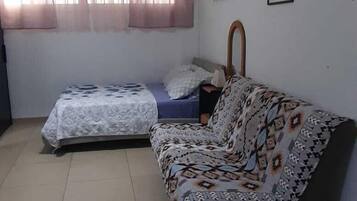 Classic Quadruple Room, 1 Bedroom, Non Smoking, City View | Living area | TV