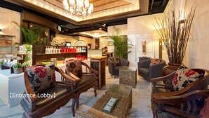 An entrance lobby with wooden furniture, a chandelier, and a display of products. - Pasela no Mori Yokohama Kannai (Yokohama)