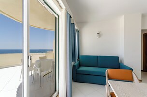 Apartment, 1 Bedroom, Sea View (Front) | Living area | Flat-screen TV