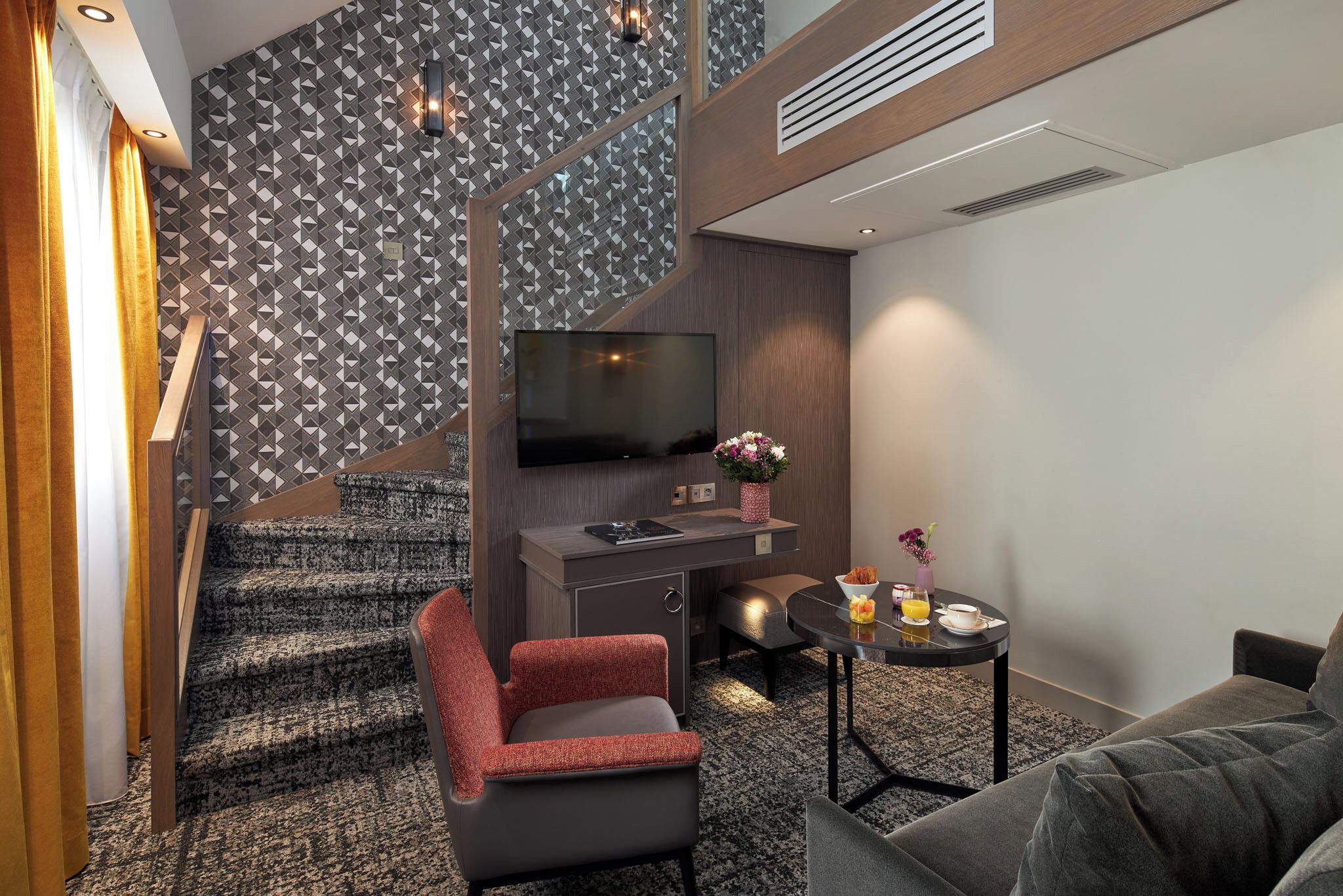 signature duplex | living area | flat-screen tv