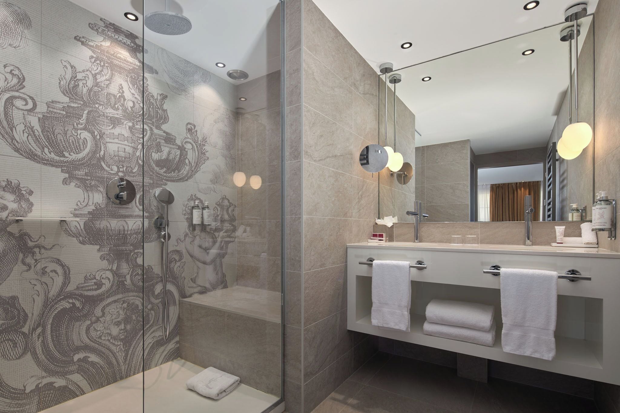 deluxe room | bathroom | designer toiletries, hair dryer, slippers, towels