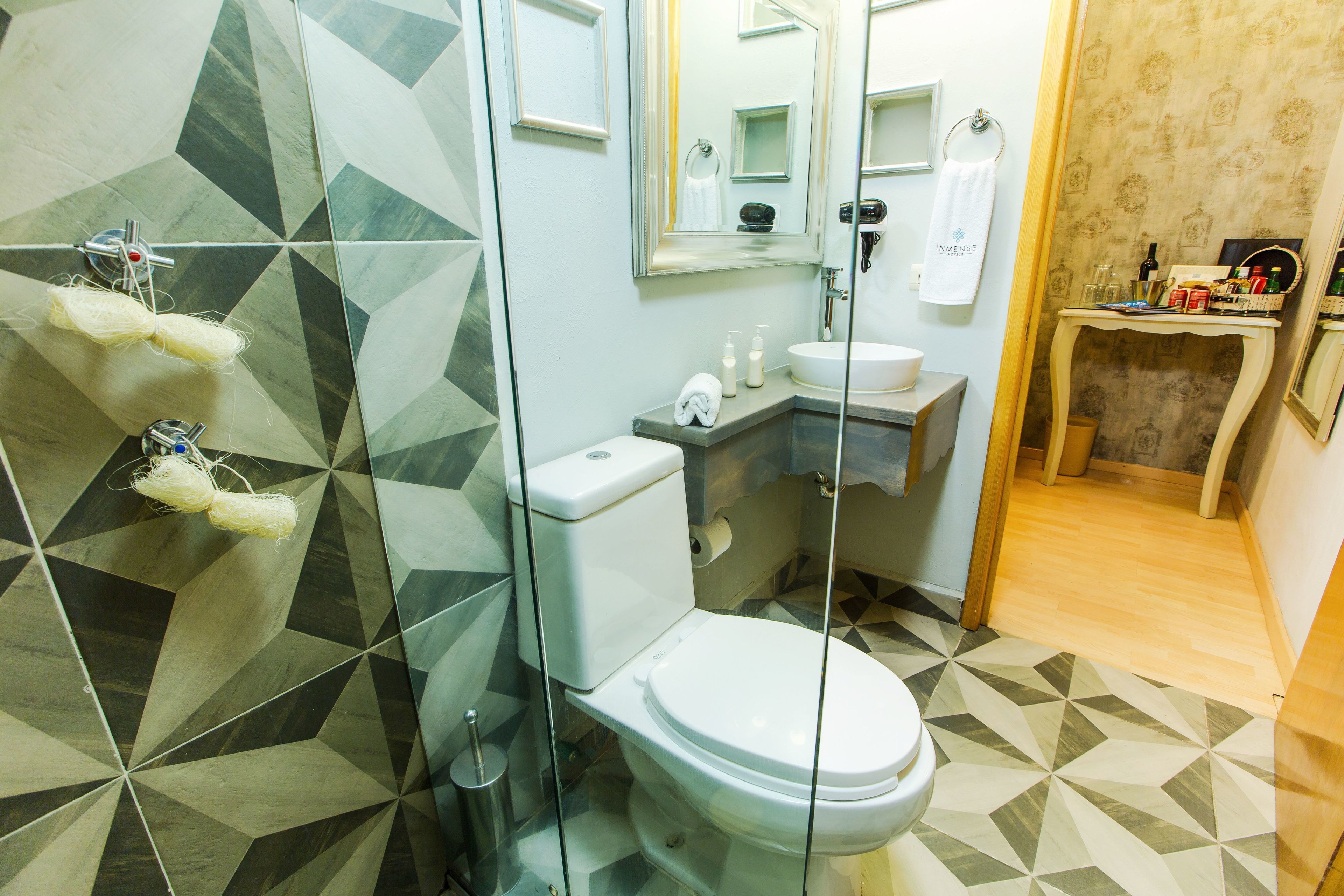 master suite | bathroom | shower, rainfall showerhead, designer toiletries, hair dryer