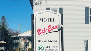 A motel sign with the name 'Bel-Ea' and a phone number.
