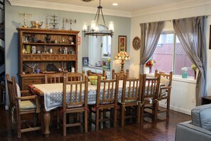 Enjoy meals in this elegant dining room with a wooden table and six comfortable chairs.