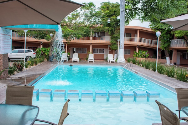 Outdoor pool, open 9:00 AM to 9:00 PM, free cabanas, pool umbrellas