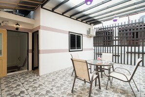 Standard Apartment, 3 Bedrooms (Rooftop) | Living area | 32-inch flat-screen TV with cable channels, TV - Royal Beach Residence (Patong)