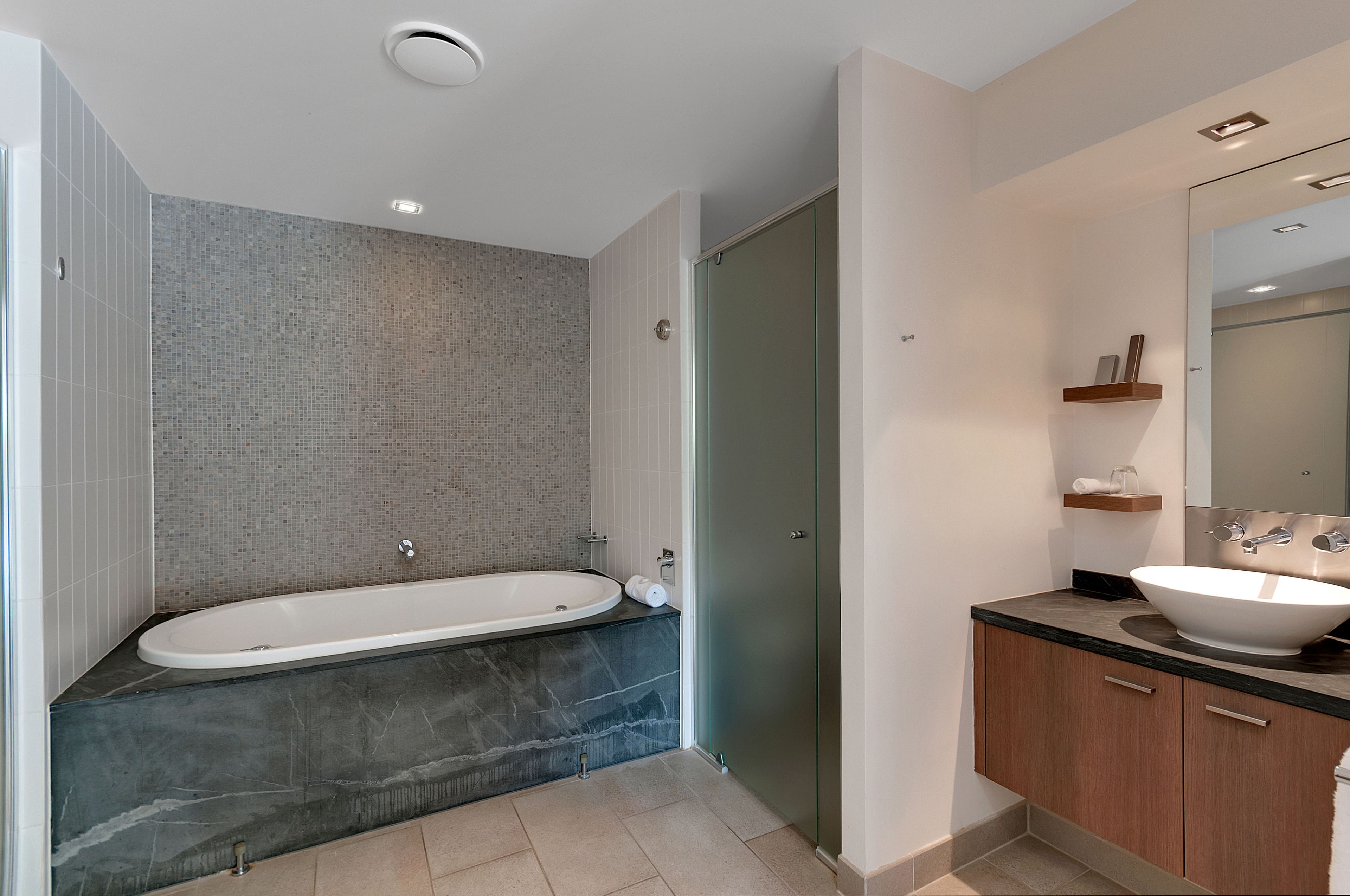 separate bathtub and shower, jetted bath, rainfall showerhead
