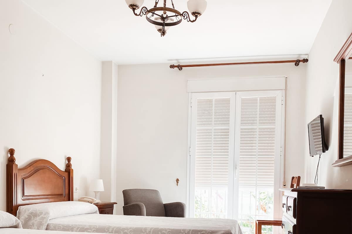 Triple Room, Balcony | Minibar, in-room safe, desk, blackout drapes