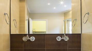 Shower, designer toiletries, hair dryer, bathrobes