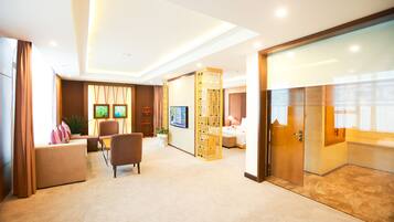 Executive Suite | Living area | 42-inch LCD TV with cable channels, TV