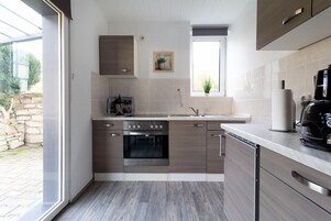Condo família | Cozinha privada | Geladeira, cooktop, chaleira elétrica, torradeira