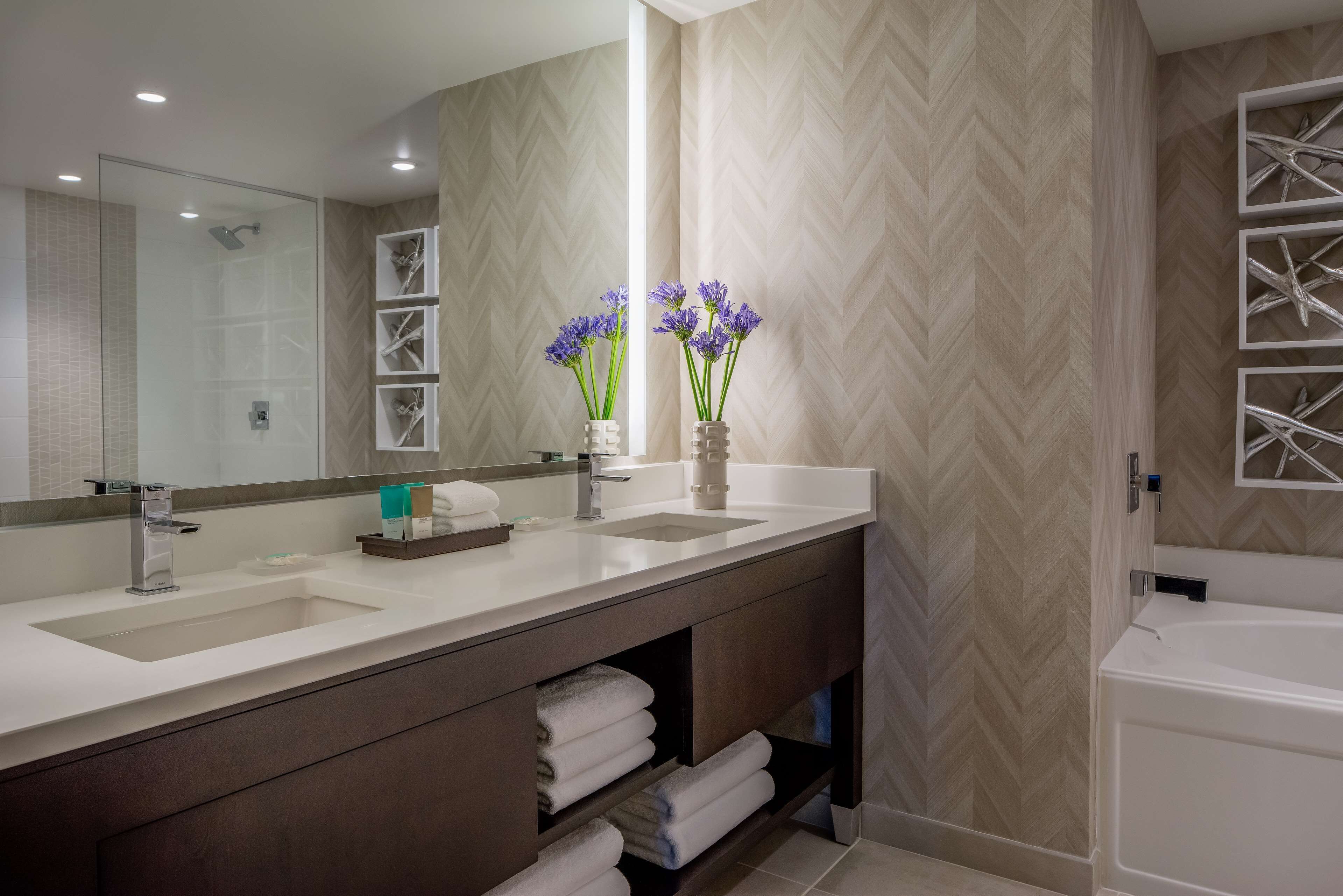 room, 2 queen beds | bathroom | free toiletries, hair dryer, slippers, towels