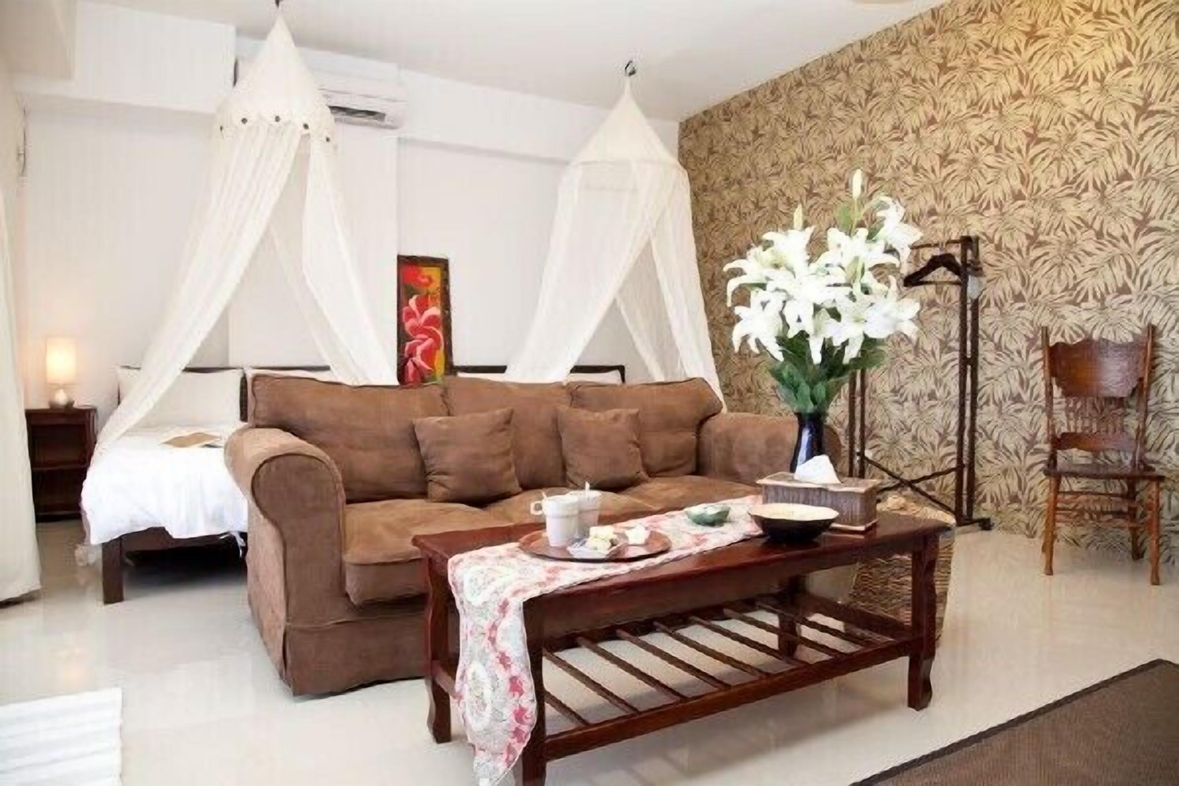 Camera quadrupla | Area soggiorno | TV