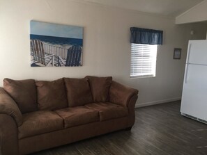 Cabin | Living area | Flat-screen TV - Northshore RV Resort on Lake Livingston (Onalaska)