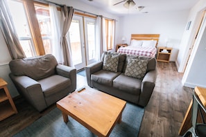 Standard Cottage, 2 Queen Beds | Living area | Flat-screen TV