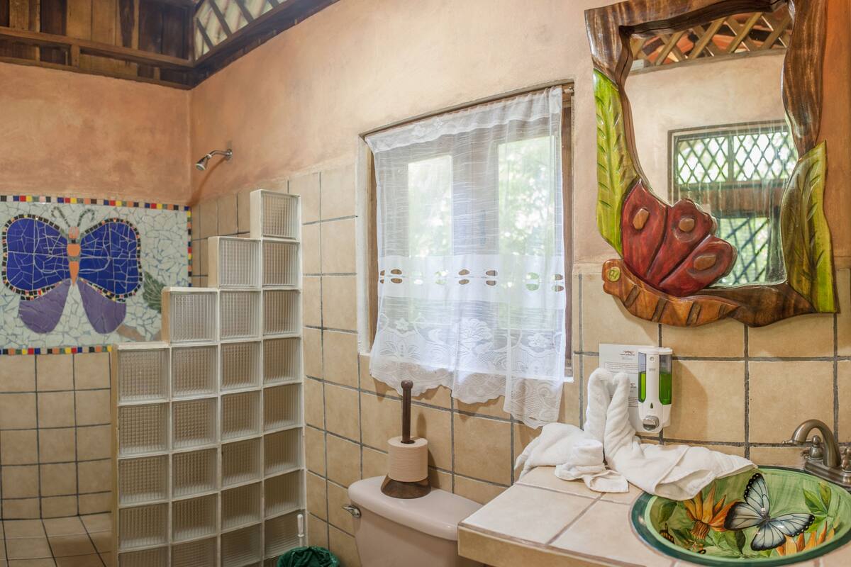 family bungalow, 2 bedrooms, balcony, garden area | bathroom | shower, free toiletries, towels, soap