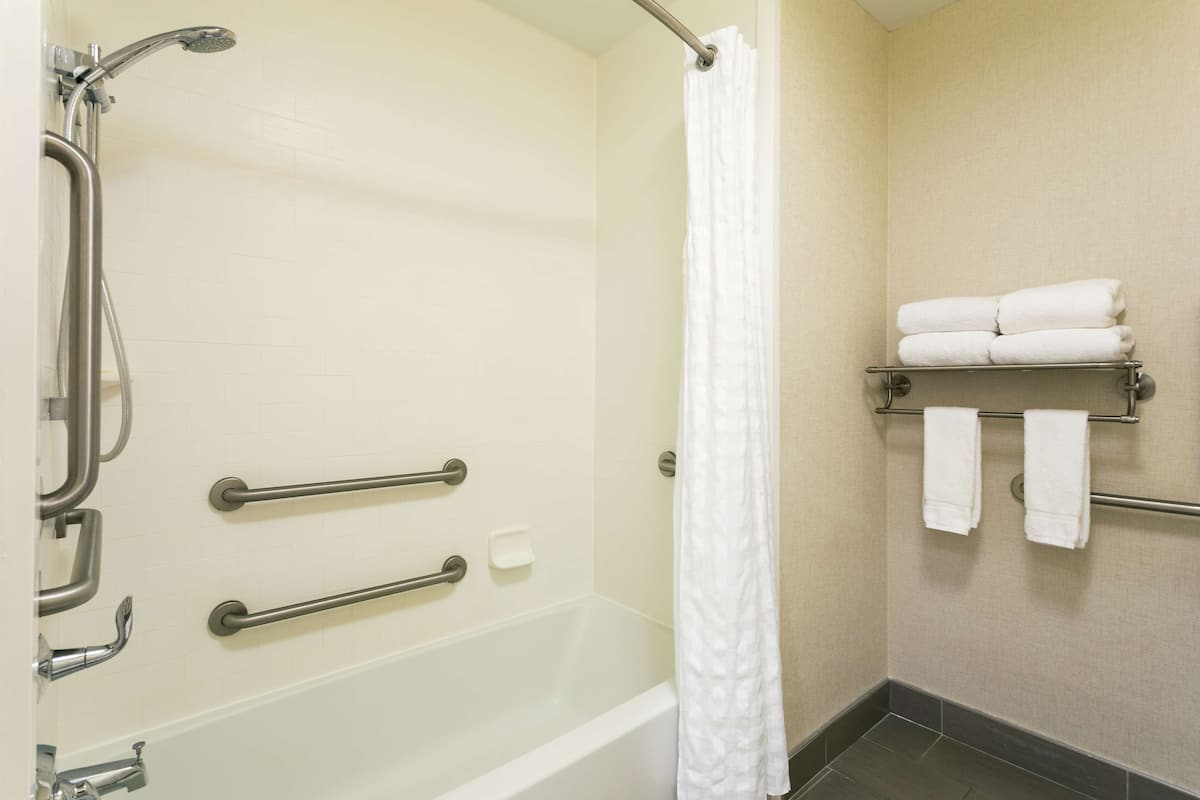 Studio, 2 Queen Beds, Accessible, Bathtub | Bathroom | Combined shower/tub, deep soaking tub, designer toiletries, hair dryer