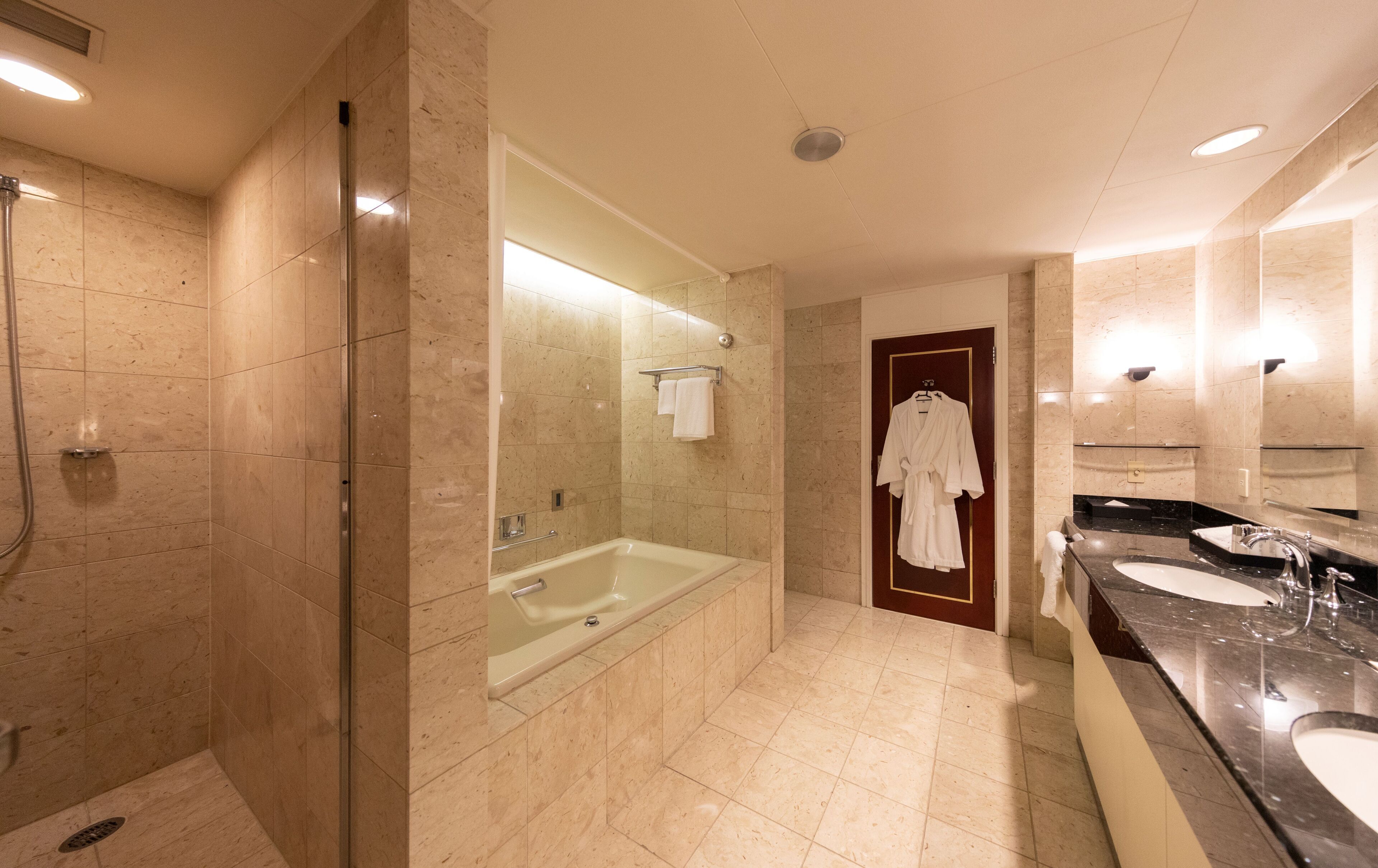 separate bathtub and shower, free toiletries, hair dryer, slippers