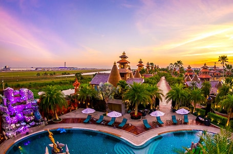 Outdoor pool, pool umbrellas. Ammata Lanta Resort