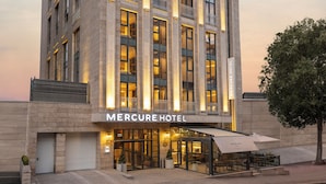A tall, modern hotel with a prominent sign reading "Mercure Hotel." - Mercure Ankara Kızılay (Ankara)