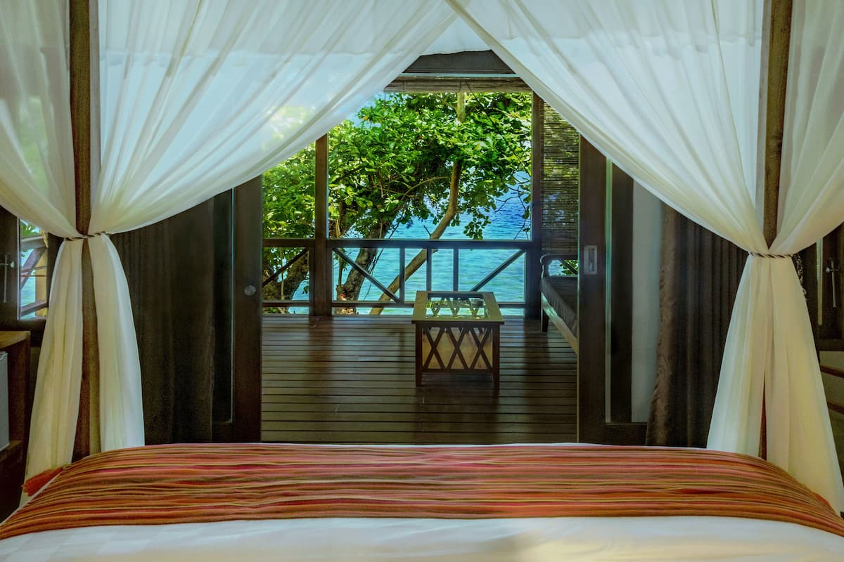deluxe double room, 1 king bed, terrace, sea facing | minibar, in-room safe, desk, blackout curtains
