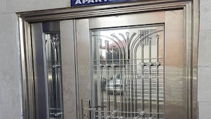 A metal gate with a sign above it reading "MAG MERCY APARTMENTS". - Magmercy Apartments (Lagos)