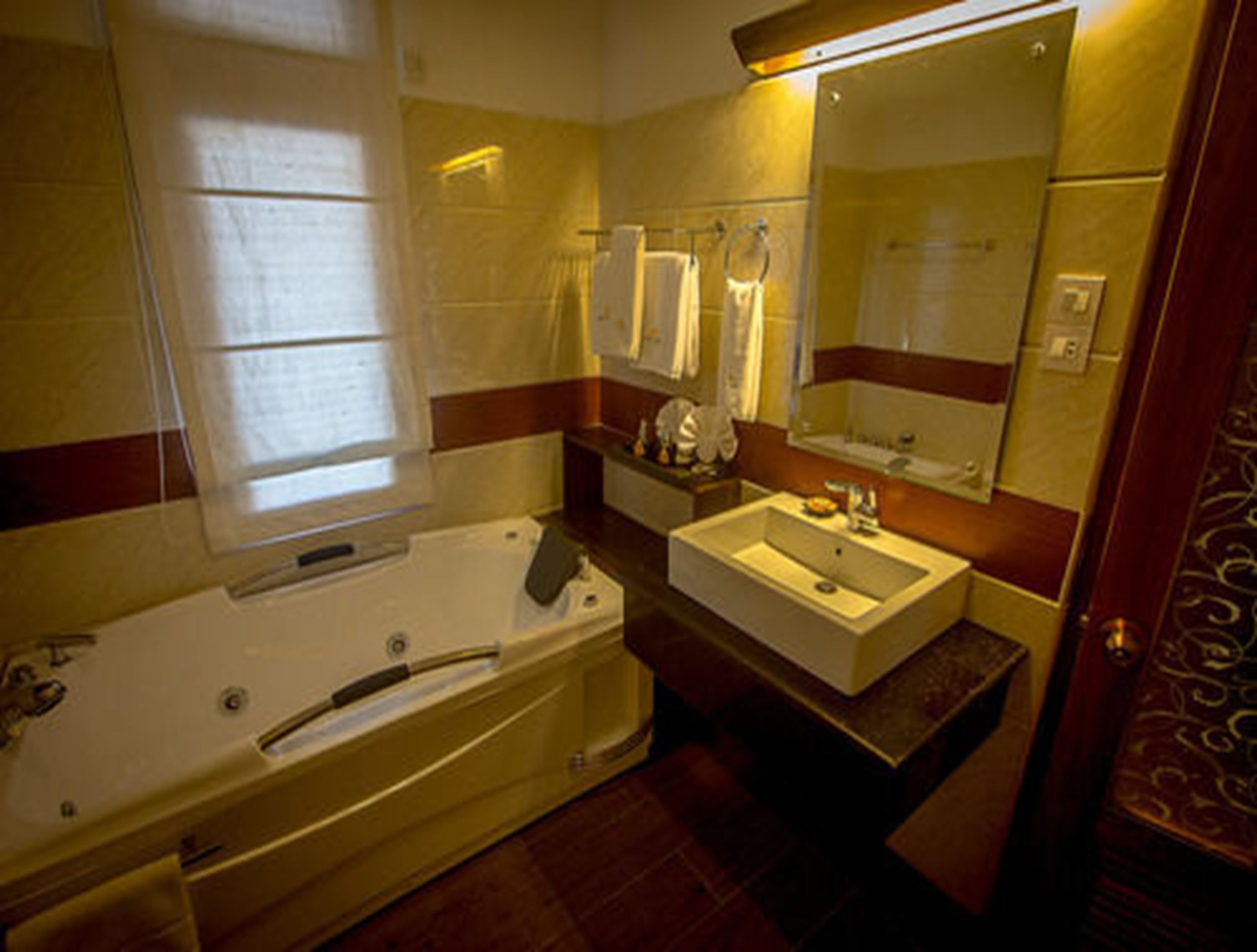 suite | bathroom | deep-soaking bathtub, rainfall showerhead, free toiletries, hair dryer