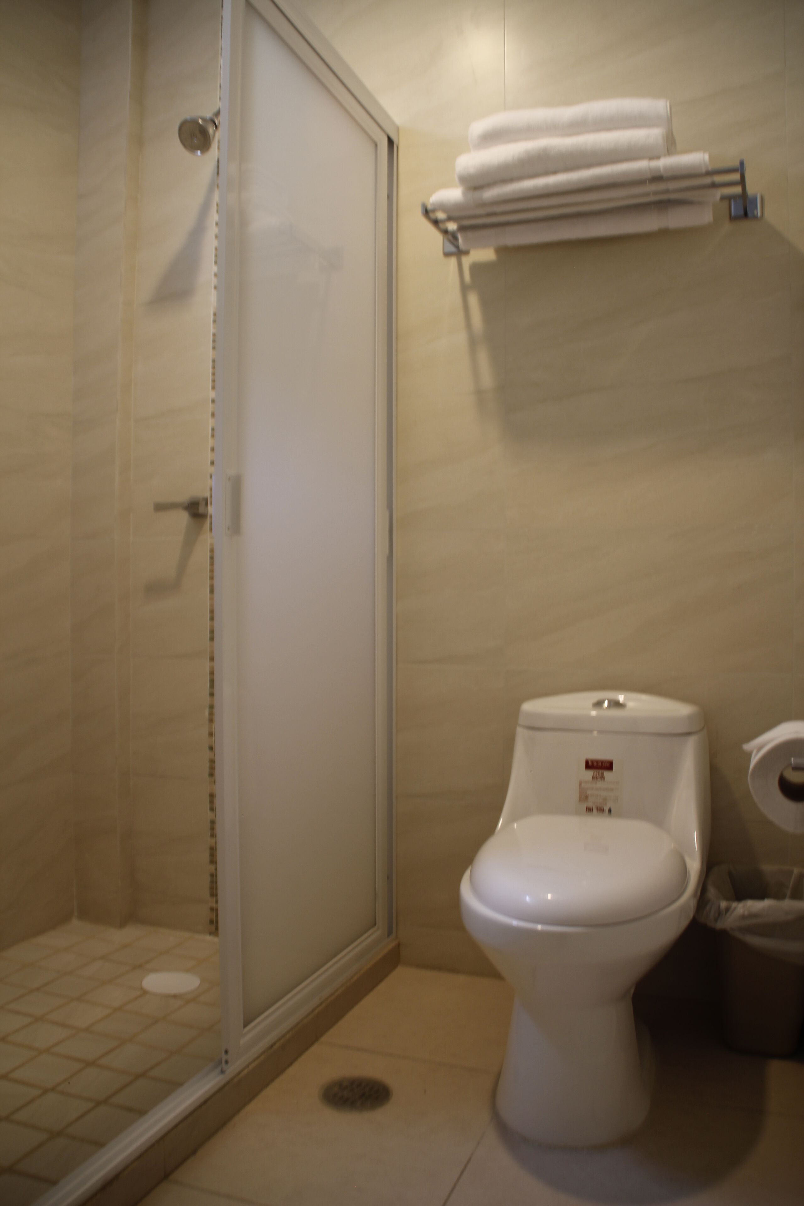 deluxe room | bathroom | shower, hair dryer, towels, soap