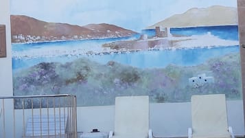Seasonal outdoor pool, open 9:00 AM to 7 PM, pool umbrellas