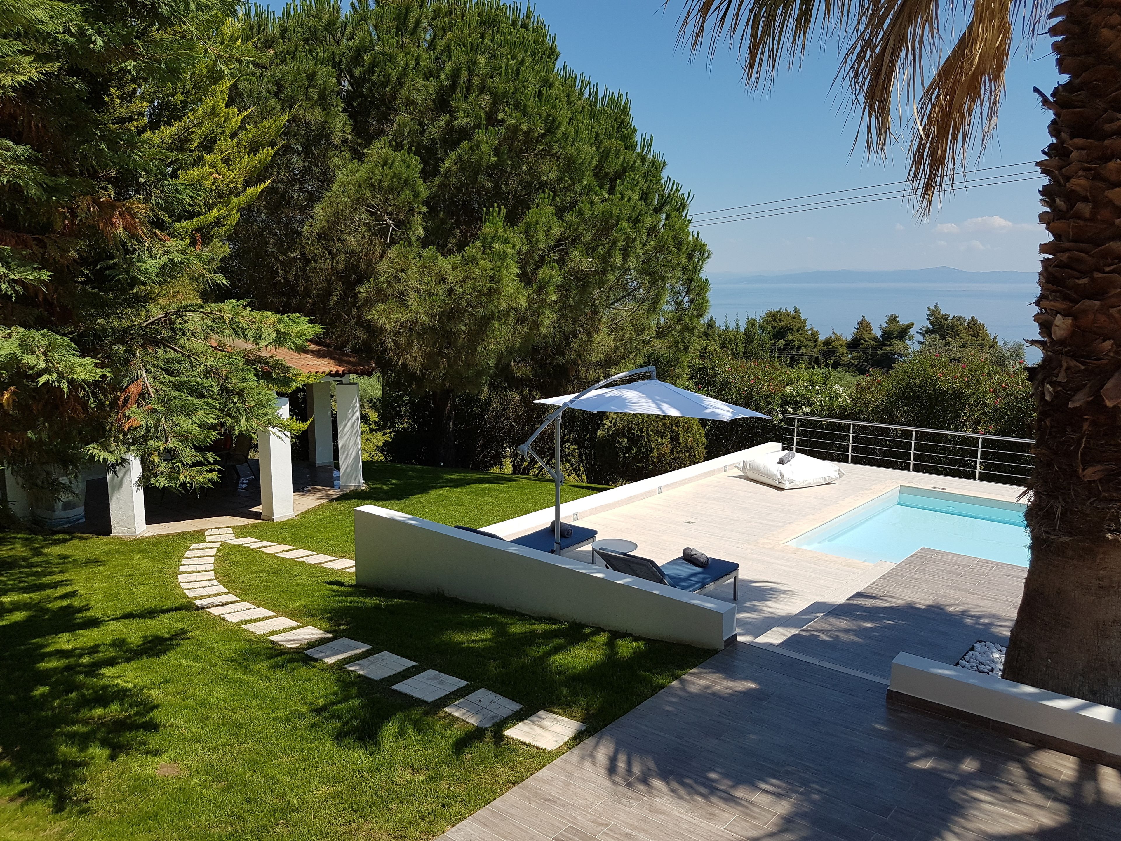 2 outdoor pools, pool umbrellas, pool loungers