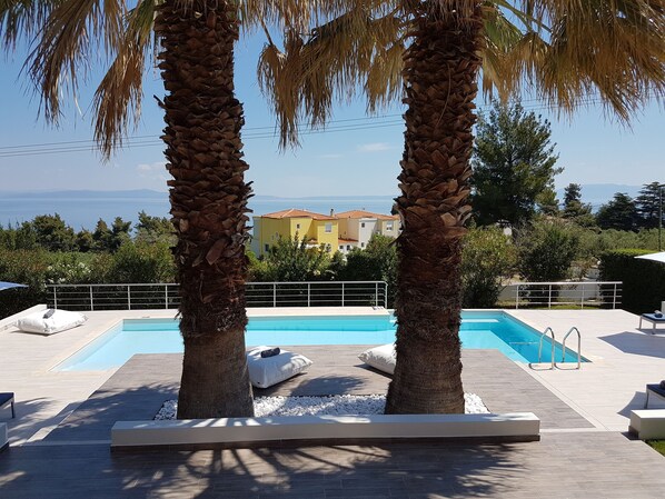 2 outdoor pools, pool umbrellas, pool loungers