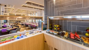 A modern hotel breakfast area with a buffet, seating, and a contemporary design. - New Splendid Hotel & Spa - Adults Only (Constanta)