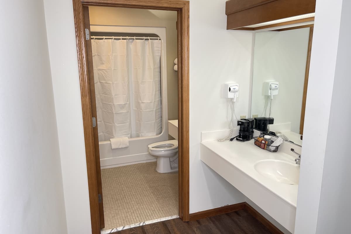 grand room, 1 king bed | bathroom | free toiletries, hair dryer, towels