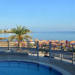 Seasonal outdoor pool, open 10:00 AM to 6:00 PM, pool umbrellas