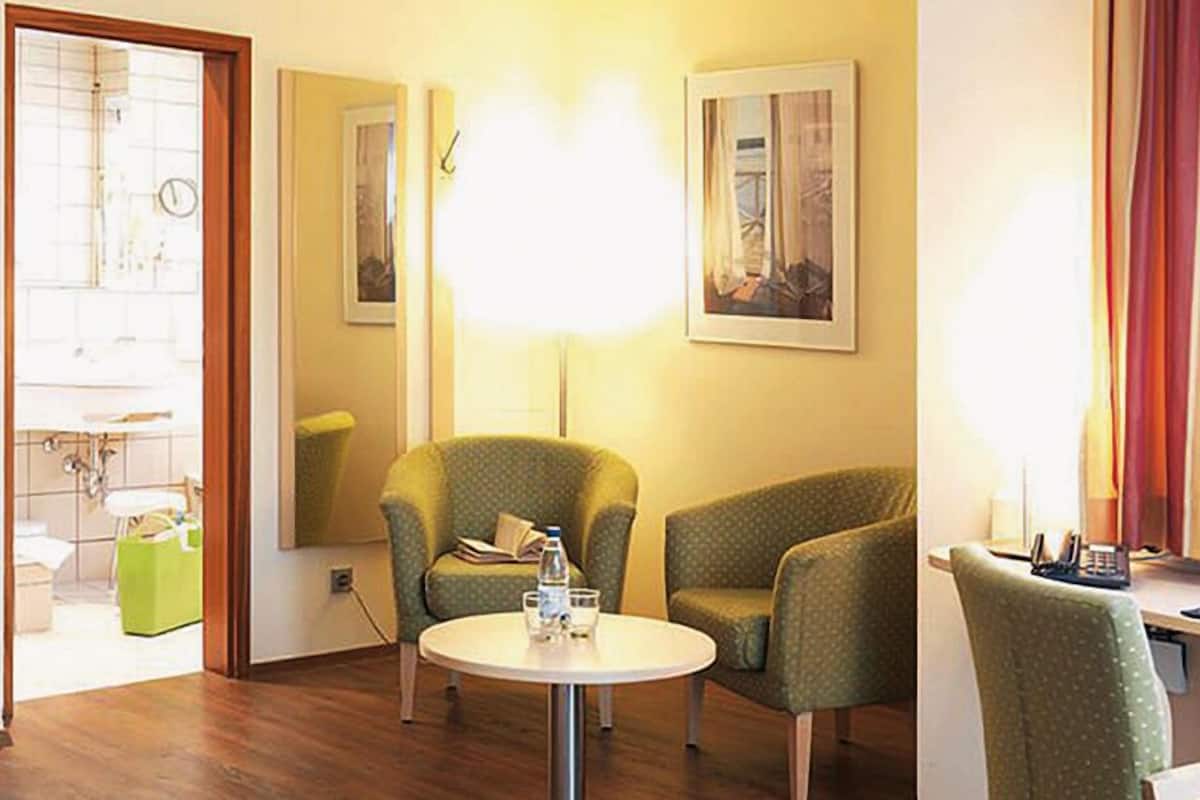 classic double room, balcony | living area | flat-screen tv