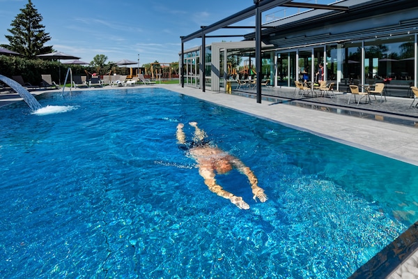 Outdoor pool, open 7:00 AM to 10:00 PM, pool umbrellas, sun loungers