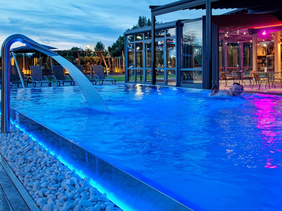 Outdoor pool, open 7:00 AM to 10:00 PM, pool umbrellas, sun loungers