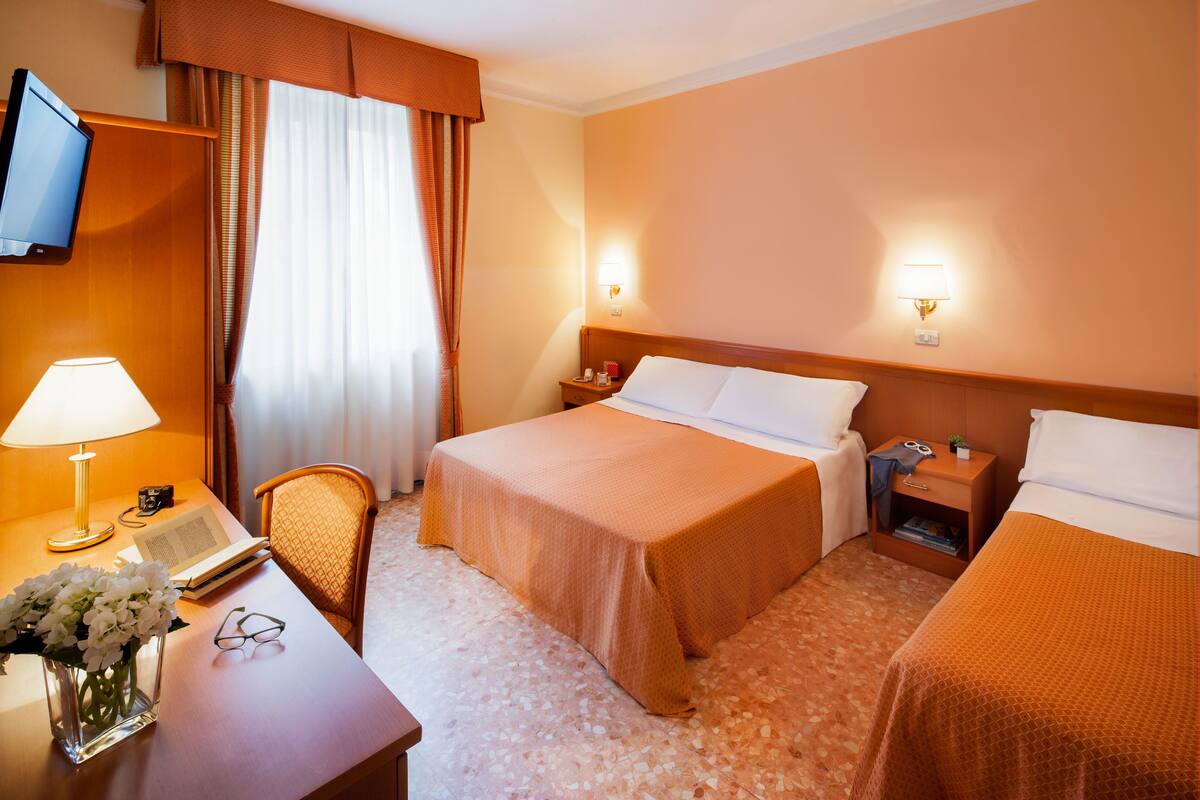 Standard Triple Room | Minibar, in-room safe, desk, blackout drapes