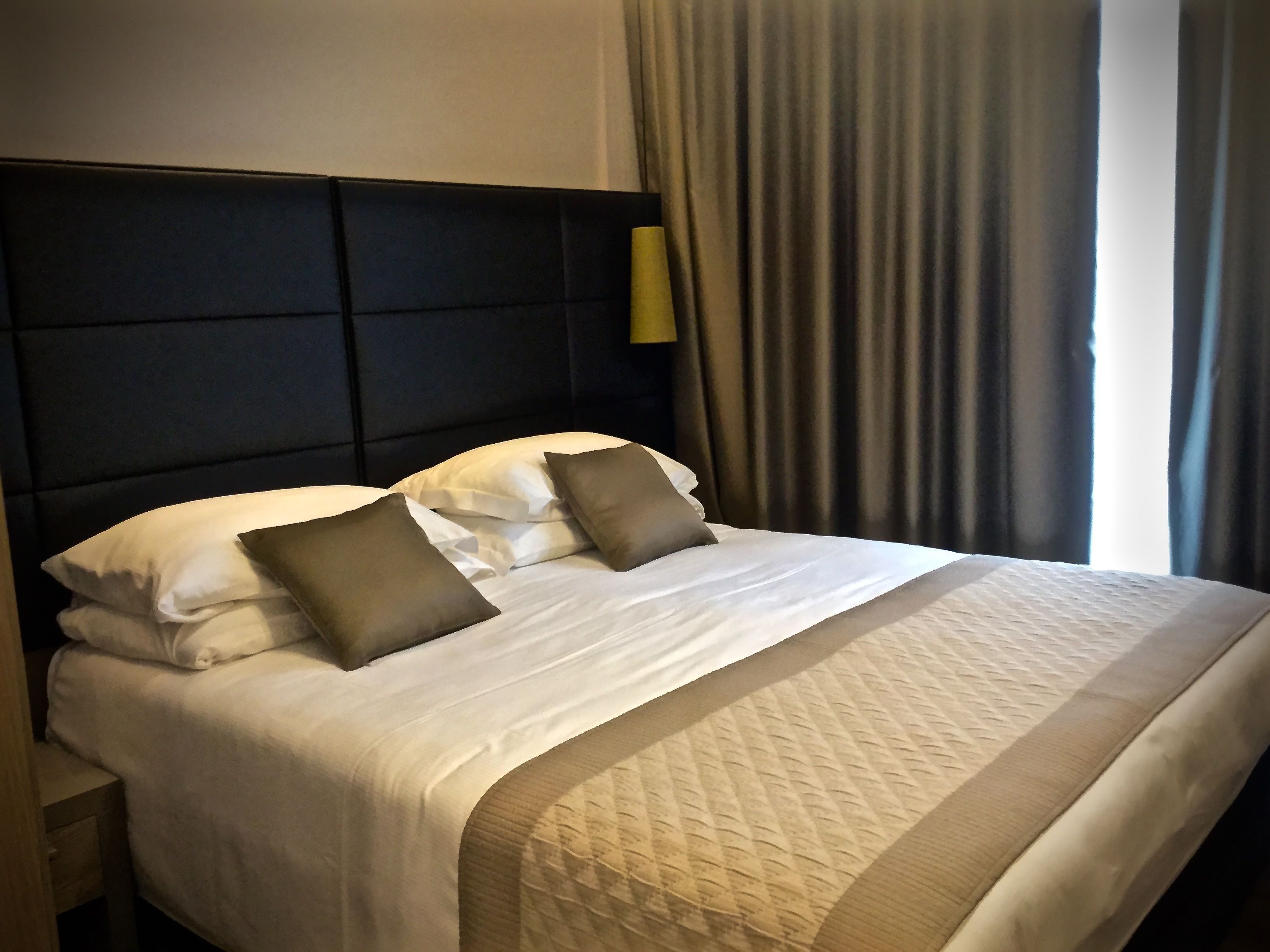 junior suite | 1 bedroom, in-room safe, desk, bed sheets