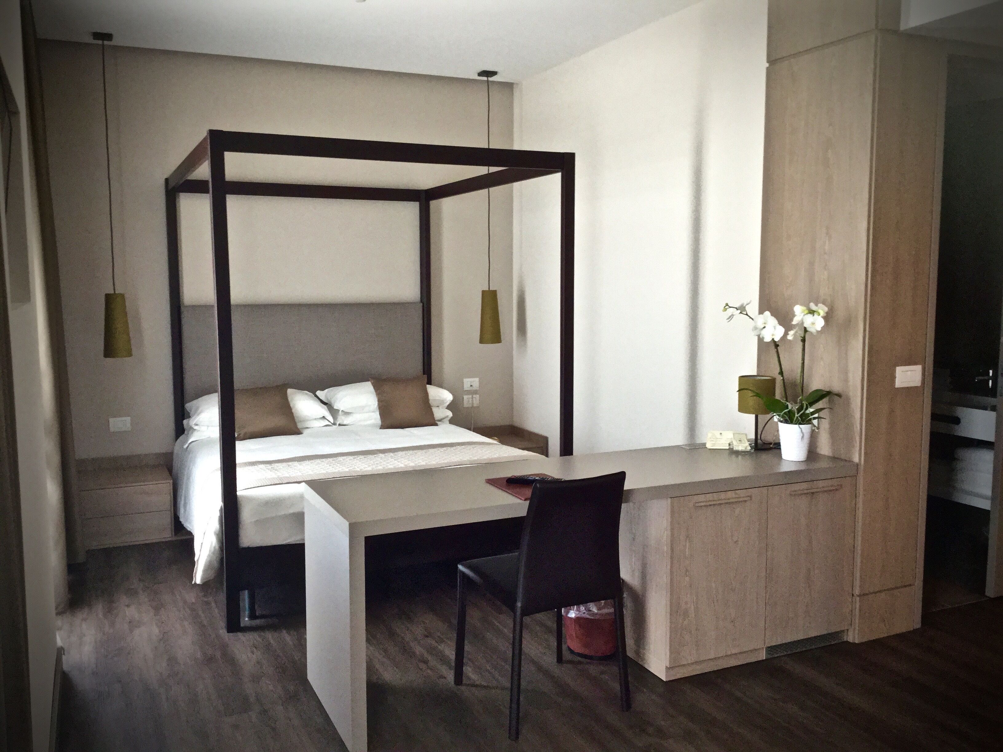 premium quadruple room | 1 bedroom, in-room safe, desk, bed sheets