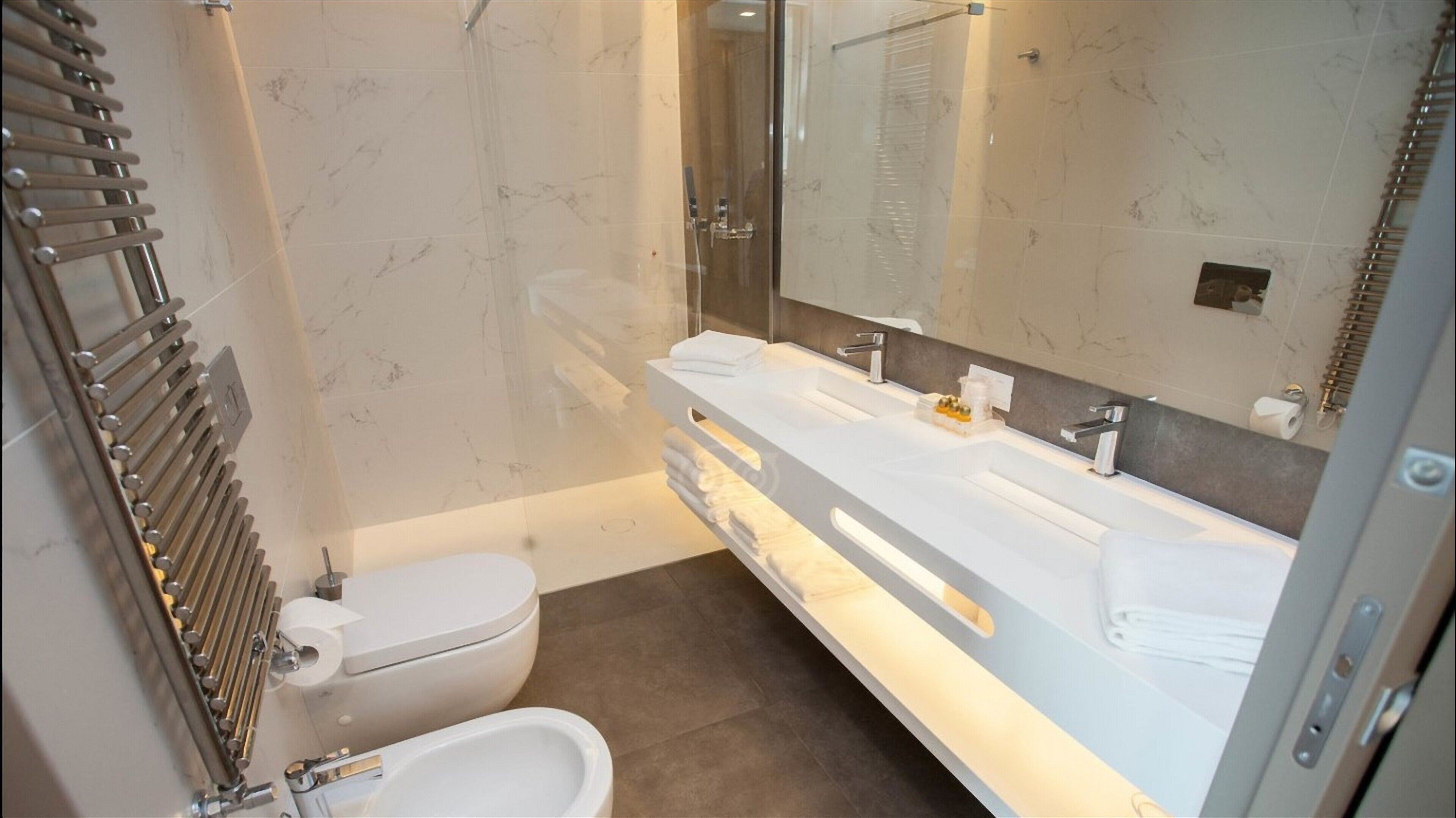 premium quadruple room | bathroom | free toiletries, hair dryer, slippers, towels