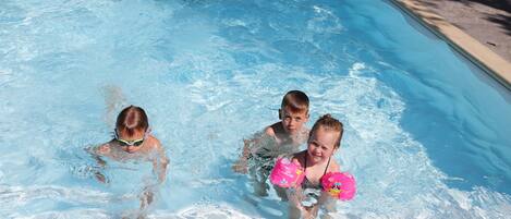 Seasonal outdoor pool, open 9:00 AM to 8:00 PM, pool loungers