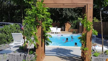 Seasonal outdoor pool, open 9:00 AM to 8:00 PM, pool loungers