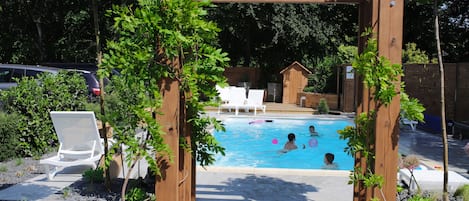 Seasonal outdoor pool, pool loungers